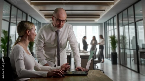 Female Analyst Receives Mentorship Guidance. Mentor Instructs Female Strategist During Review Session
