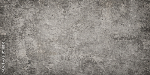 A dark grunge concrete wall with a rough grey stone texture and aged cement material creates a vintage dirty backdrop
