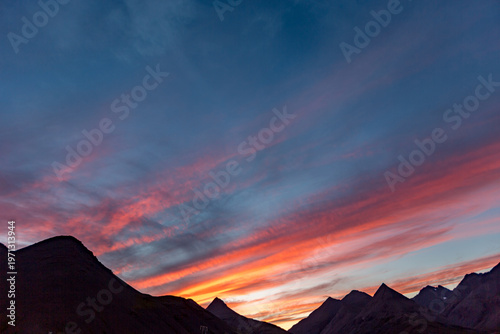 A solitary moment through the landscape somewhere in Diamond Beach, Iceland as sunset spills across the sky