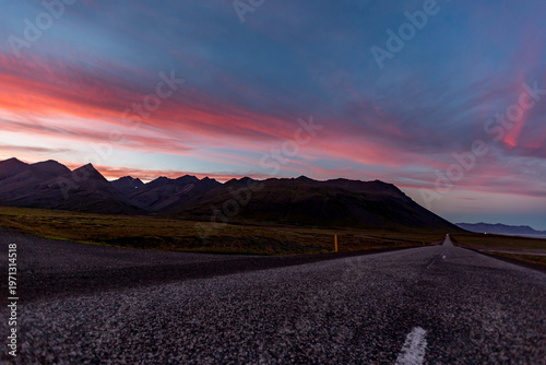 Rugged mountains leads toward distant peaks across Diamond Beach, Iceland