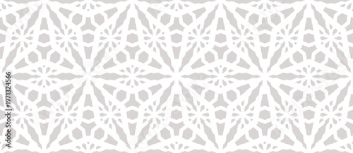 Abstract vector ornamental geometric seamless pattern. Subtle pale grey and white floral lattice, weave, grid. Winter frosty texture. Elegant background ornament. Repeated design for decor, print
