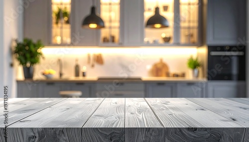 A modern kitchen showcases a wooden tabletop foregrounding a blurred backdrop of gray cabinets, warm lighting, and appliances