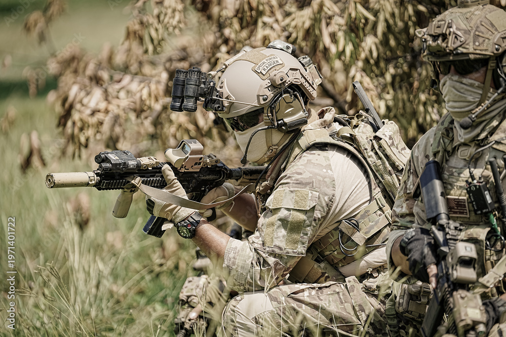 Fototapeta premium Special forces soldiers in camouflage gear with tactical equipment during a mission