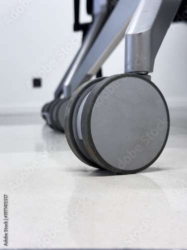 Office Chair Wheels on Polished Floor Reflection