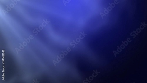 Blurry abstract background with shades of blue and purple hues.
