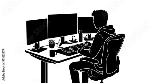 Man sitting at computer desk.