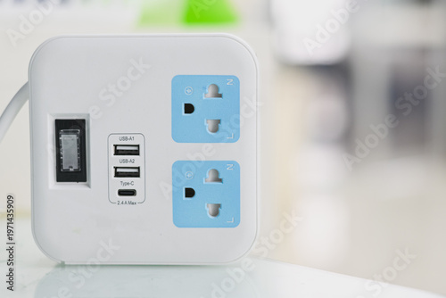 Konstfotografi A white power strip with USB and charging ports.