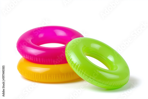 Bright colored pool floats stacked on top of each other