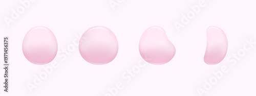 Droplets of skincare serum or gel. Pink liquid cosmetic drops isolated on light pink backdrop