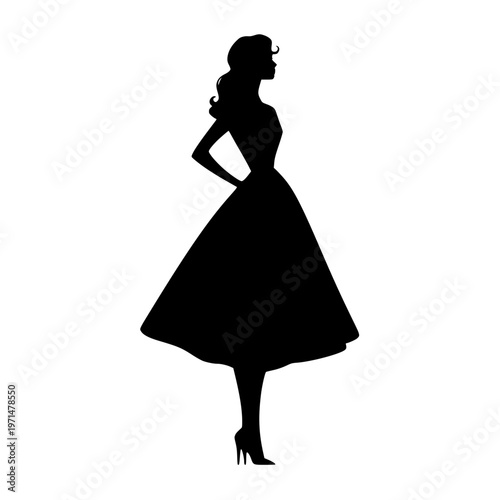 Elegant woman in a dress standing confidently with her hand on her hip