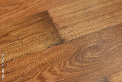 Fotografía Close-up of wooden floor with a section showing a lighter, polished area next to
