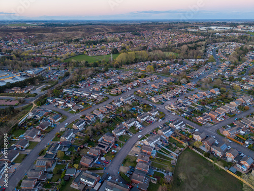 Aerial view of Canford Heath housing estate looking towards Tower Parl at sunset