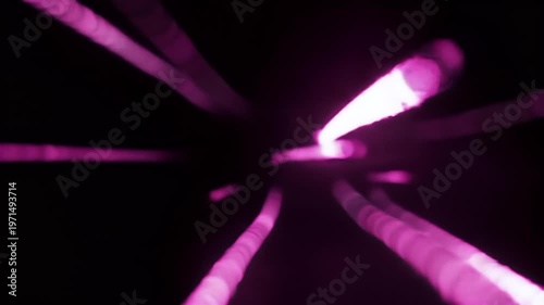 Vibrant pink neon lights radiate outward in all directions from a central point in a dark environment.