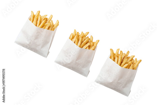 Three paper bags of crispy golden french fries
