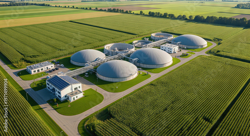 An aerial view of a large biogas plant in a rural landscape