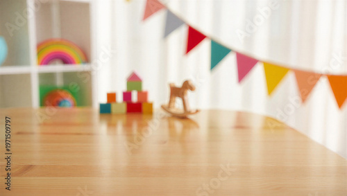 Photos Empty wooden table surface with blurred playroom background and colorful decorat
