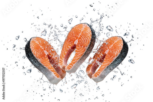 Fresh raw salmon steaks with water splashes