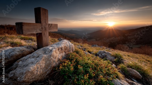 Cross on a hilltop at sunset creates tranquil atmosphere