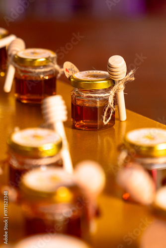 фотографія glass jars with honey