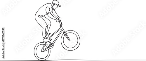 Single continuous line of a person riding a bmx bicycle performing a wheelie trick on a flat surface isolated on a white background representing extreme sports and active lifestyle themes