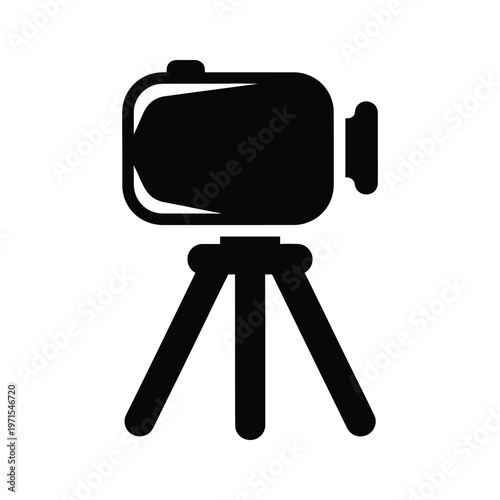 A video camera mounted on a tripod for steady recording and filming.