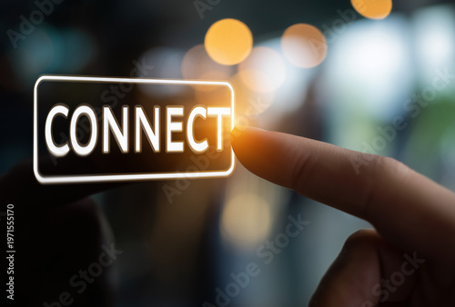 a hand touching a virtual screen with the word 