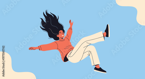 Smiling young woman with long black hair falling freely through a clear blue sky with soft clouds for freedom concept.