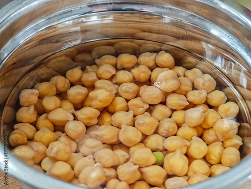 Metal Bowl with Soaked Chickpeas in Water Close Up of Raw Chickpeas Preparation Before Cooking