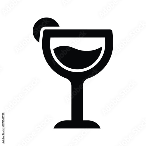 A stylish wine glass with a slice of lemon on the rim