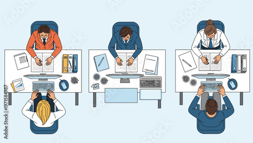 Overhead view of diverse employees working at separate office desks with computers, documents, and stationery in a productive workspace.