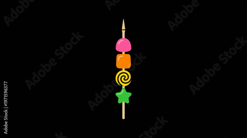 Colorful Candies on a Skewer Against Black Background