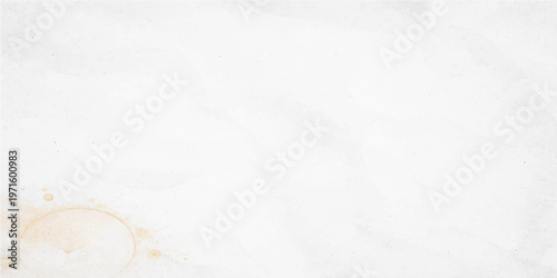 Subtle coffee stain on a white background, suggesting a moment of pause or creative thought.