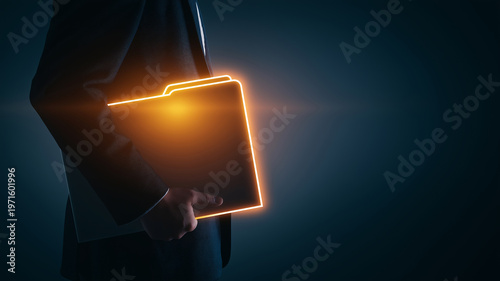 Businessman holding glowing digital folder, presenting secure data information and important confidential documents