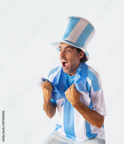 Fanatic man with top hat, t-shirt and Argentine flag