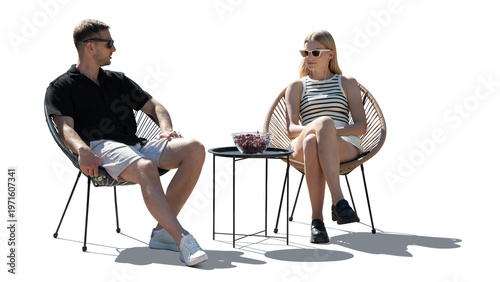 Obraz na plátne Man and woman sitting comfortably outside in chairs and talking, isolated on whi