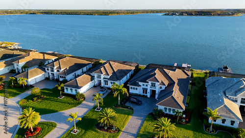 Luxury housing aerial photo of Southwest Florida retirement community on a lake.