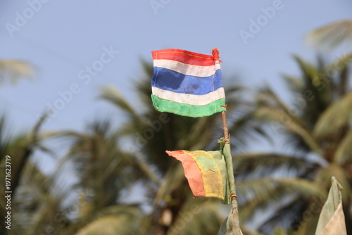 Banjul, Gambia. 27-02-2026. A small flag in Gambian colours on the bow a fishing boat.