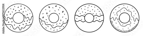 Four black and white donuts with sprinkles and icing doodles