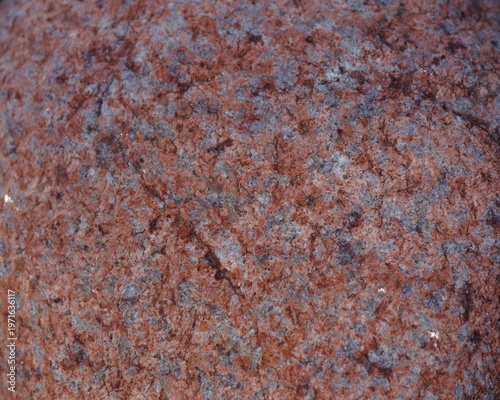 A Close-up of the Rough Surface of a Pink and White Rock