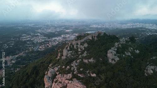Aerial drone view around Pena Palace, Moorish castle and Village Palace from ex Portuguese monarchy. Sintra town, Lisbon, Portugal
