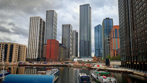 Canvas Print Modern Residential Buildings Along the River Thames under a Cloudy Sky, London