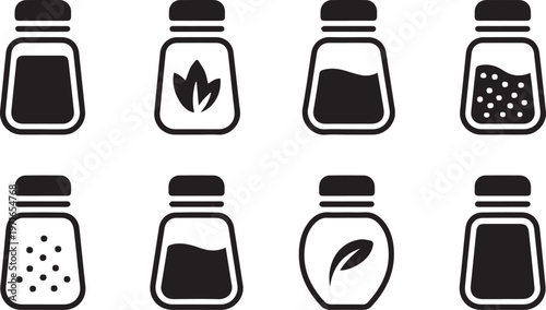 Set of black and white seasoning shakers, various shapes and designs depicting salt, pepper, and herbs for cooking