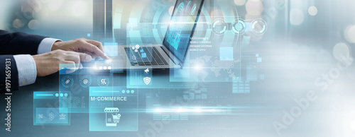 Cuadro en lienzo Businessman using laptop to analyze and control mobile commerce data