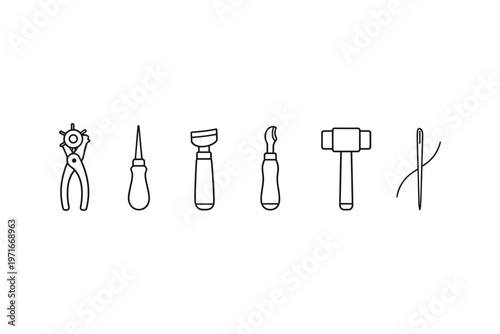 Collection of leathercraft tools including a punch, awl, skiving knife, and hammer