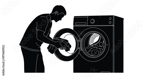 Young man loading laundry into a modern washing machine depicted as a simple black vector graphic