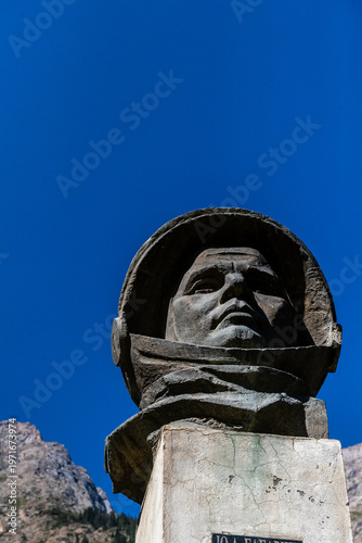 Outdoor scene showing a statue of Cosmonaut Juri Gagarin in the mountains of Kyrgyzstan, near Barskoon valley.