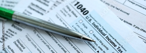 Photography 1040 US Individual Income tax return blank form and pen on accountants table