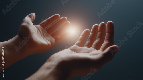 Human hands reaching toward a soft glowing light, conveying hope, openness, and emotional warmth.