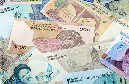 Wallpaper Mural Iranian rial money banknotes pile on table. Iran bills of IRR currency close up. Concept of economy Torontodigital.ca