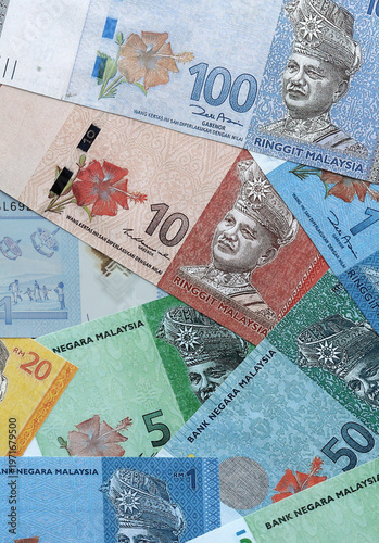 Wallpaper Mural Malaysian ringgit money banknotes pile on table. Malaysia bills of MYR currency close up Torontodigital.ca